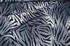 Kleiderstoff grau gemustert Tiger
